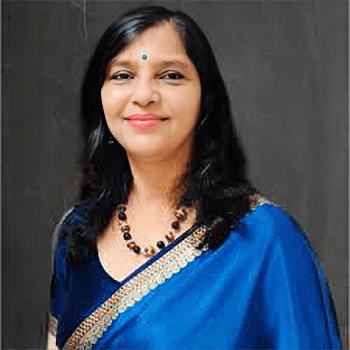 A professional headshot of Dr. Mamta Soni smiling, wearing a blue saree and a necklace.
