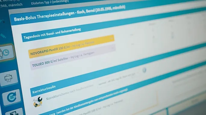 Close-up of the GlucoTab® electronic diabetes medication management system on a screen, displaying insulin therapy settings and dosage recommendations.